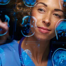 A female doctor analyzing brain scans.